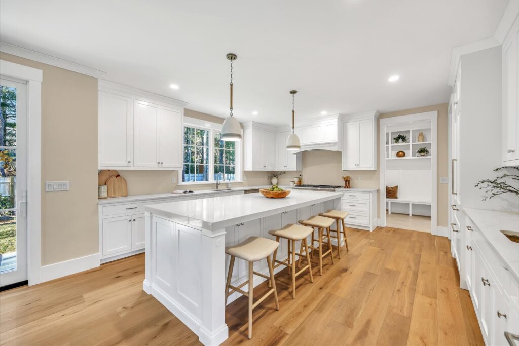 White kitchen with large center island at 6 Willow Circle, Mashpee