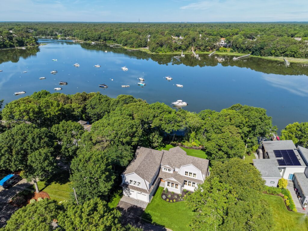 Aerial view of 640 Poponessett Road on Shoestring Bay in Cotuit