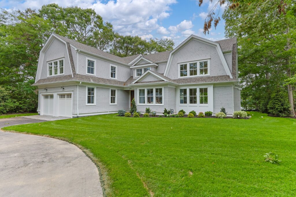 Front exterior and lawn of 640 Poponessett Road, Cotuit